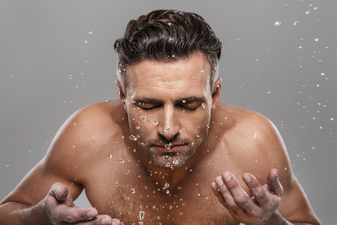 Handsome Mature Man Washing His Face.